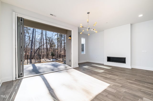 interior space featuring an inviting chandelier and wood-type flooring