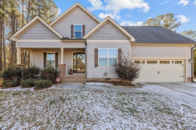 view of front of property featuring a garage and covered porch