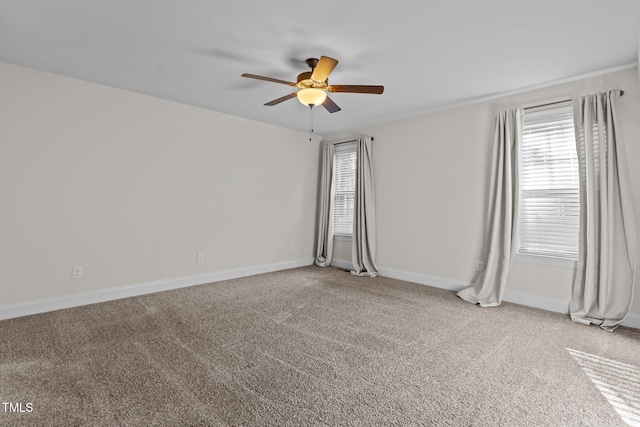 unfurnished room featuring ceiling fan and carpet