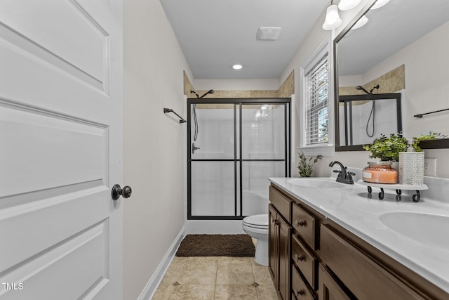 bathroom with an enclosed shower, vanity, and toilet