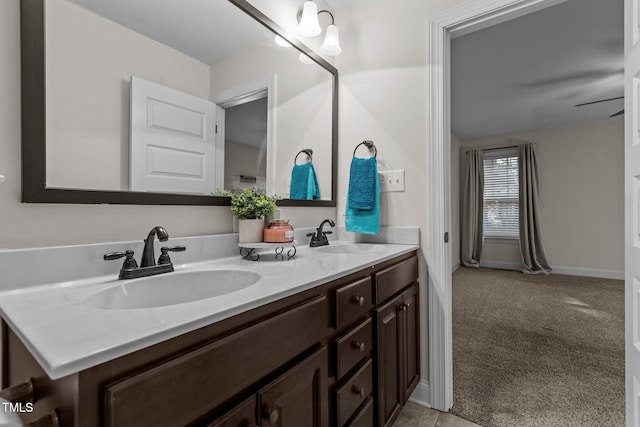 bathroom with ceiling fan and vanity