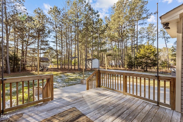 wooden deck featuring a storage shed