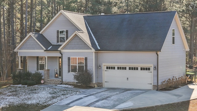 view of front facade featuring a porch and a garage