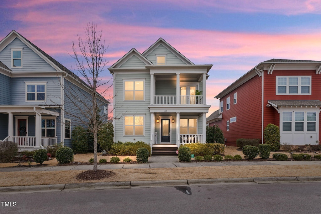 view of front of house featuring a porch and a balcony