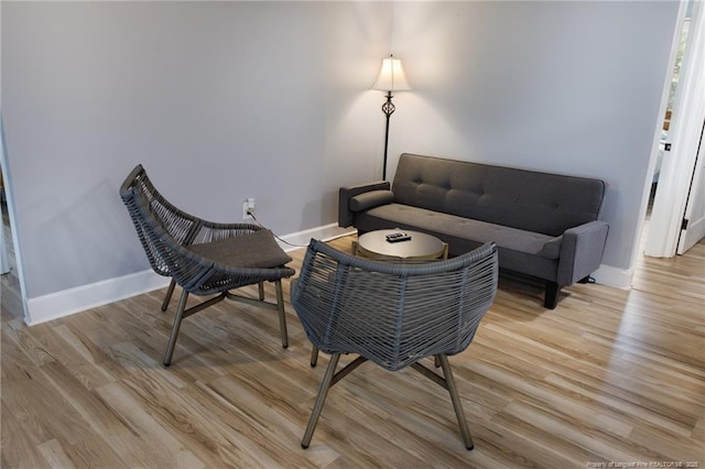 living area with light hardwood / wood-style floors