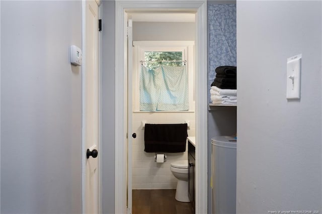 bathroom with toilet, wood-type flooring, and vanity