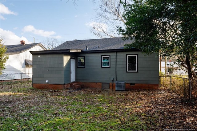 rear view of house with central AC