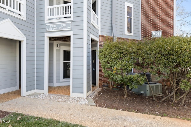 doorway to property with central air condition unit