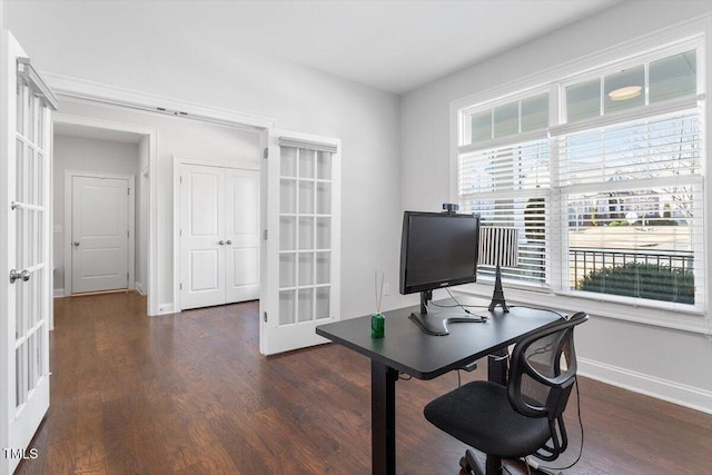 home office with baseboards, dark wood-style floors, and french doors