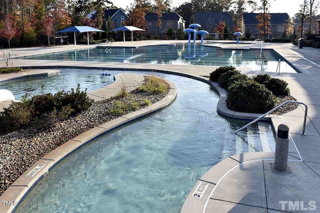 community pool with a patio