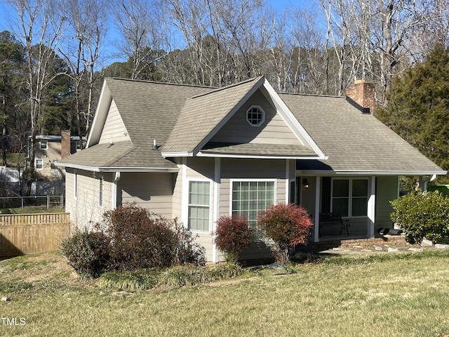 view of front of house featuring a porch and a front lawn