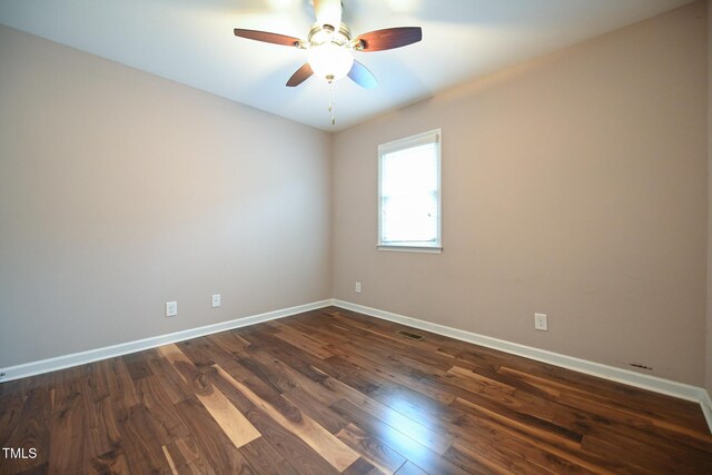 unfurnished room featuring ceiling fan and dark hardwood / wood-style flooring