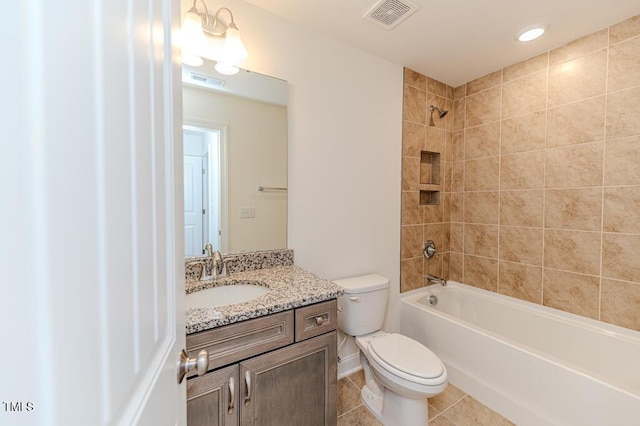 full bathroom with toilet, tiled shower / bath combo, tile patterned flooring, and vanity