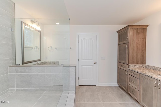 bathroom with tile patterned flooring and vanity