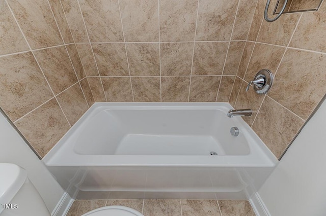 bathroom with tile patterned flooring and toilet