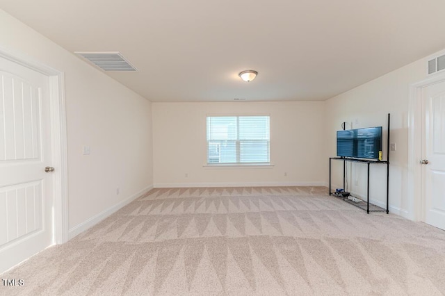 empty room with light colored carpet