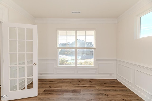 unfurnished room with dark wood-type flooring and crown molding