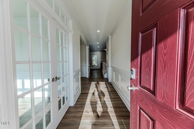 hallway featuring french doors, crown molding, and dark hardwood / wood-style floors