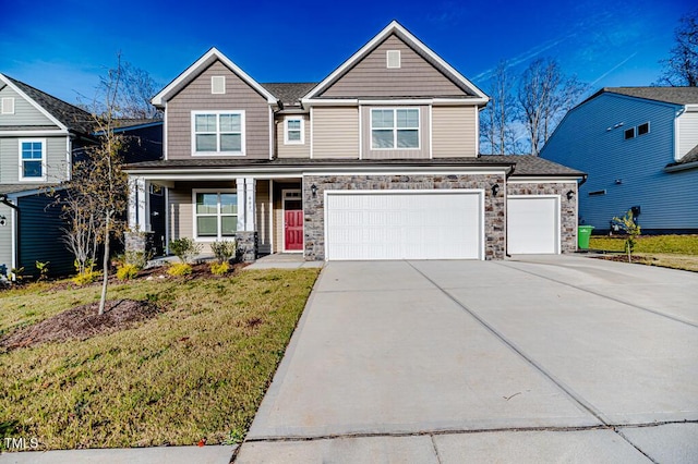 view of front of house featuring a front yard and a garage