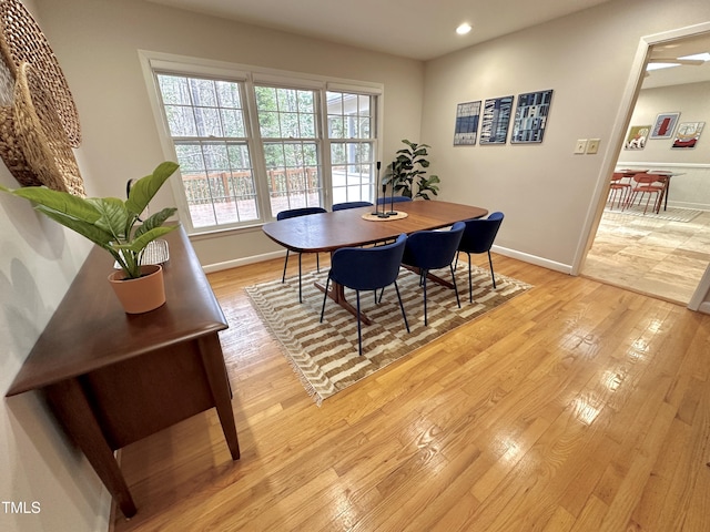 dining room with light wood-style floors, baseboards, and recessed lighting