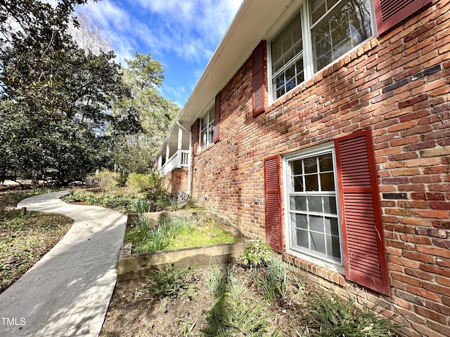 view of home's exterior featuring brick siding