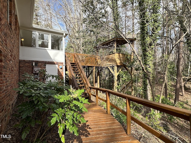 wooden deck featuring stairs