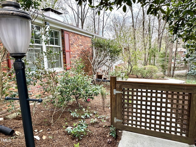 exterior space featuring brick siding