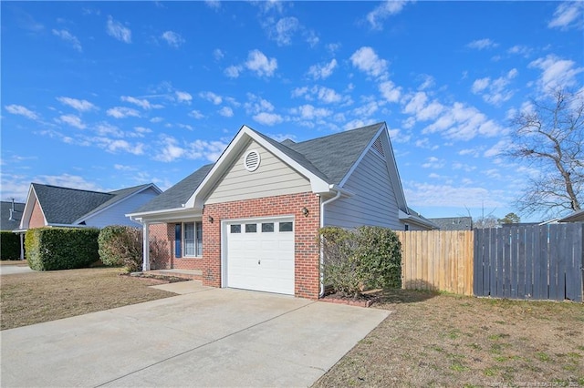 view of side of property with a garage and a yard