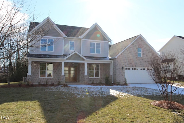 view of front of house featuring a front yard and a garage