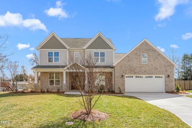 craftsman house featuring a front yard, brick siding, driveway, and fence