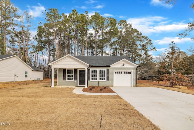 ranch-style house featuring a garage, covered porch, and a front lawn