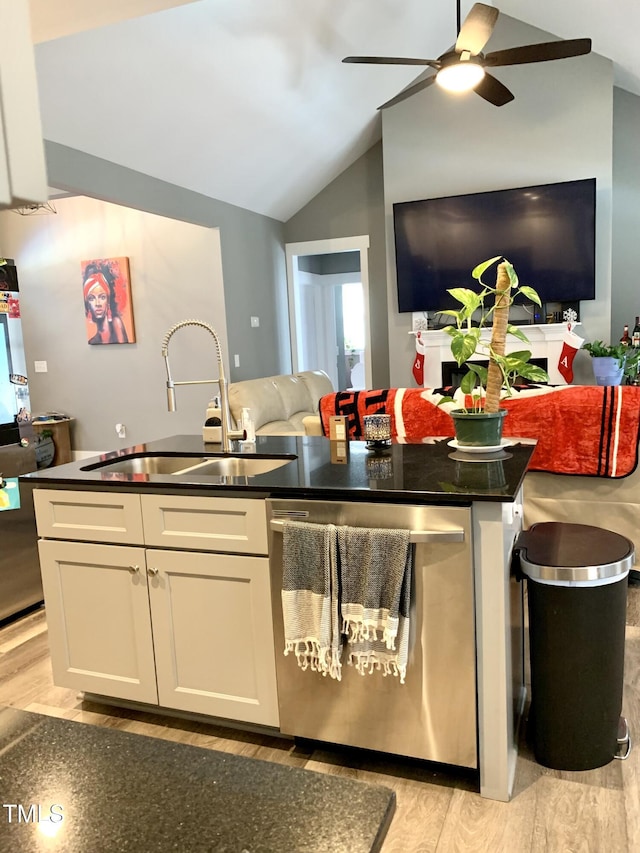 kitchen with white cabinets, dishwasher, lofted ceiling, light hardwood / wood-style floors, and sink