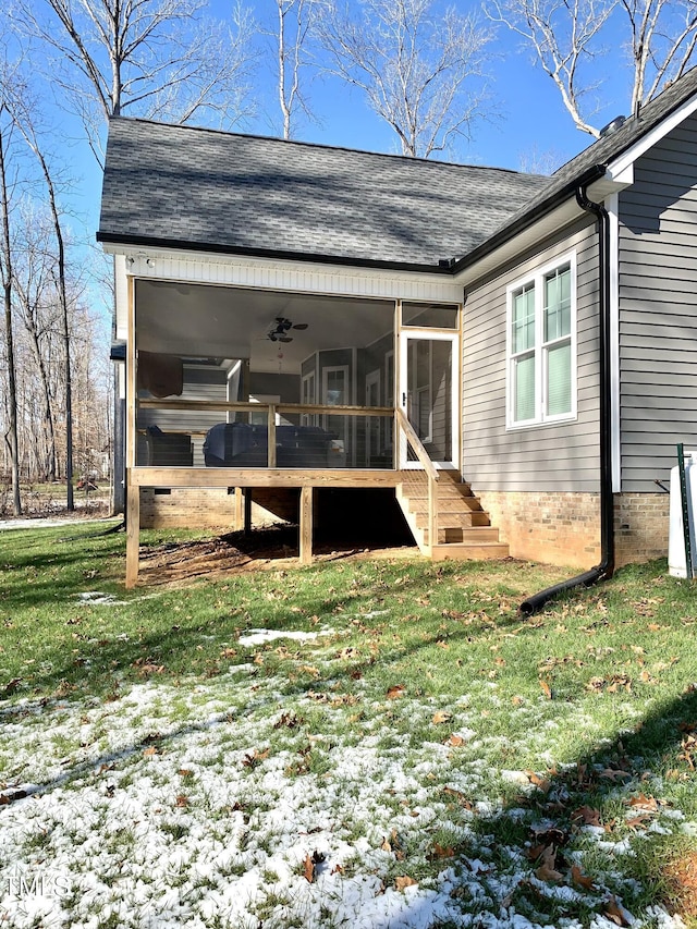 exterior space with a lawn and a sunroom