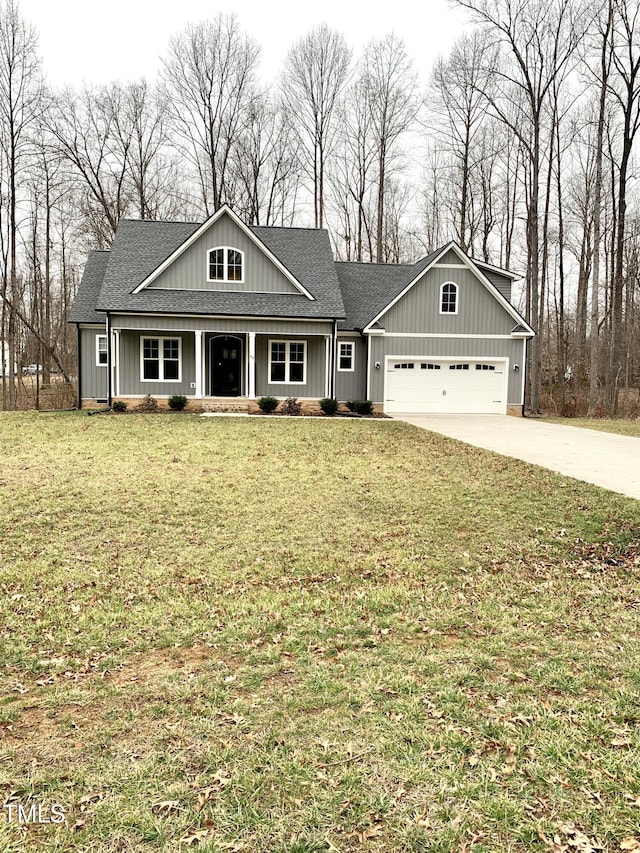 view of front of house featuring a garage and a front yard