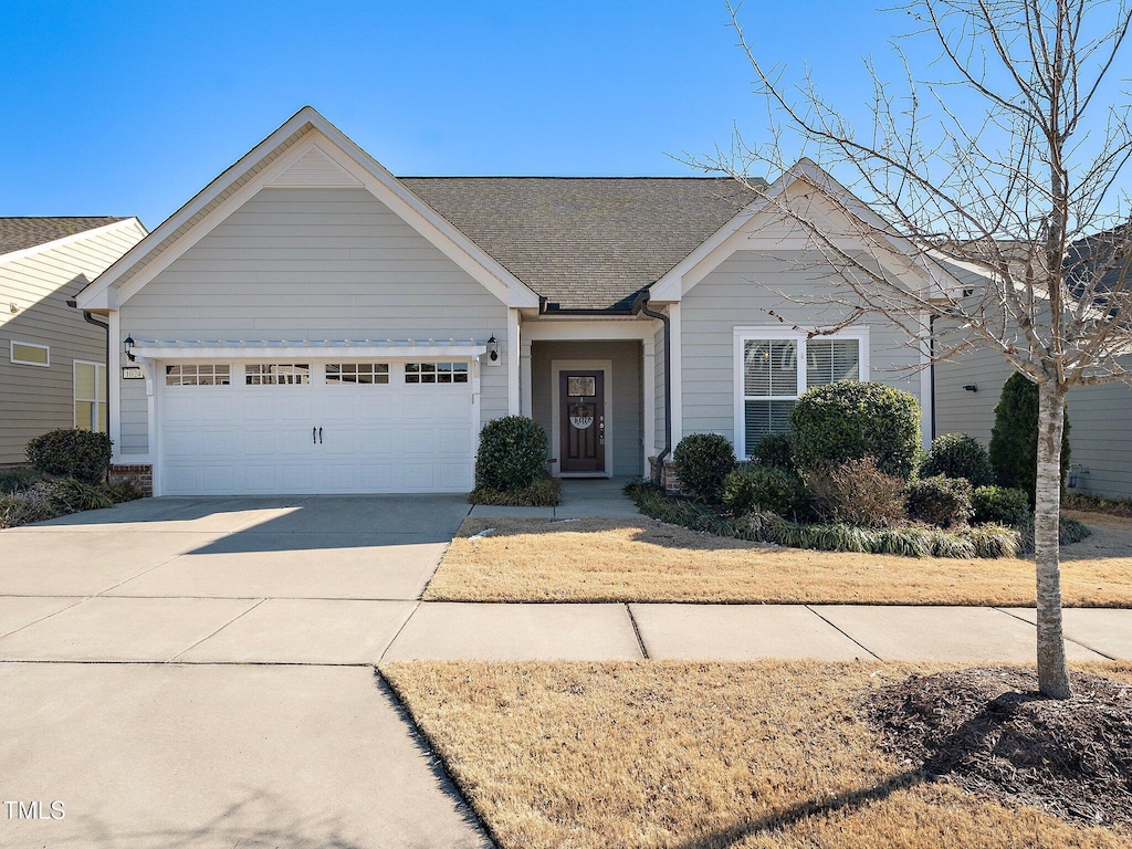 ranch-style home featuring a garage