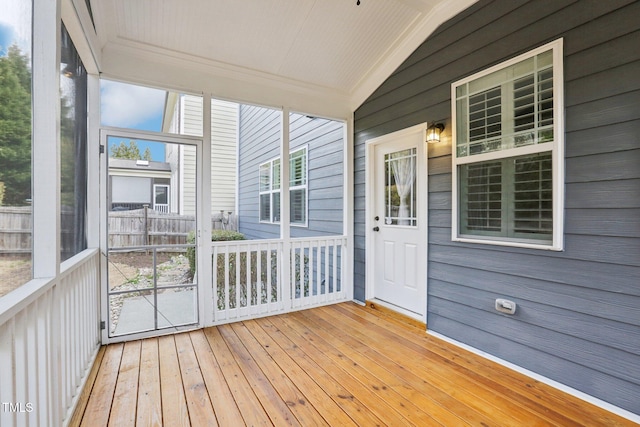 unfurnished sunroom with vaulted ceiling