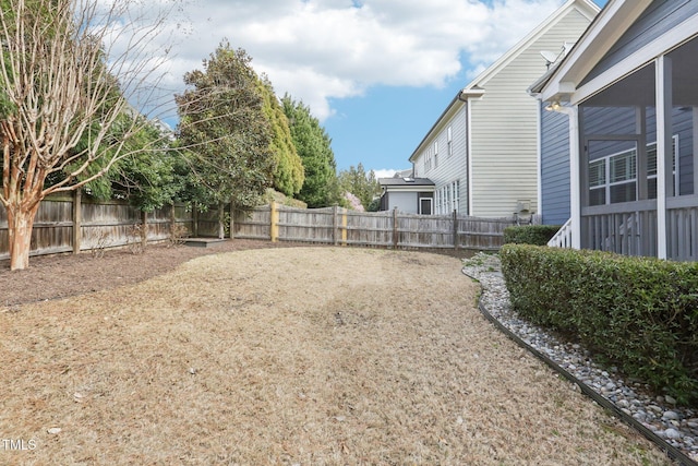 view of yard with a fenced backyard