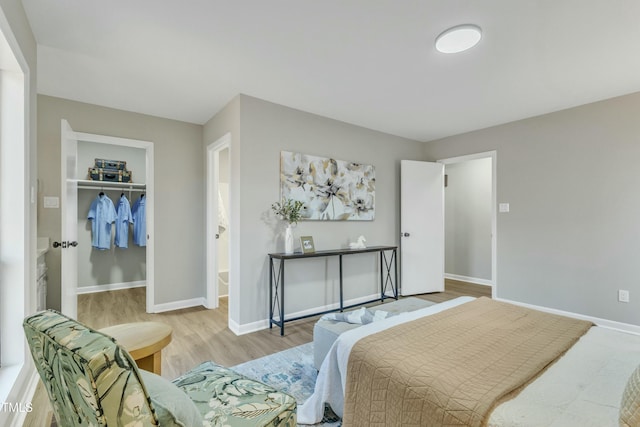 bedroom with a closet and light wood-type flooring