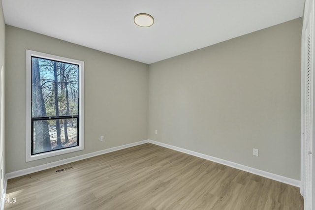 unfurnished room featuring light hardwood / wood-style flooring