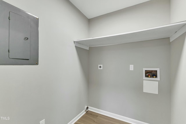 washroom featuring electric panel, hookup for an electric dryer, hardwood / wood-style floors, and washer hookup