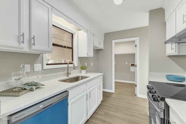 kitchen with stainless steel appliances, white cabinetry, and sink