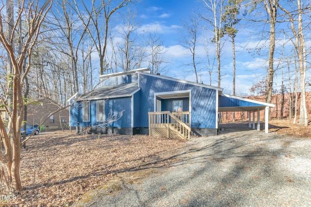 view of side of property with a carport