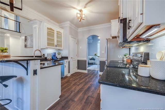 kitchen with sink, stainless steel appliances, white cabinets, dark hardwood / wood-style floors, and crown molding