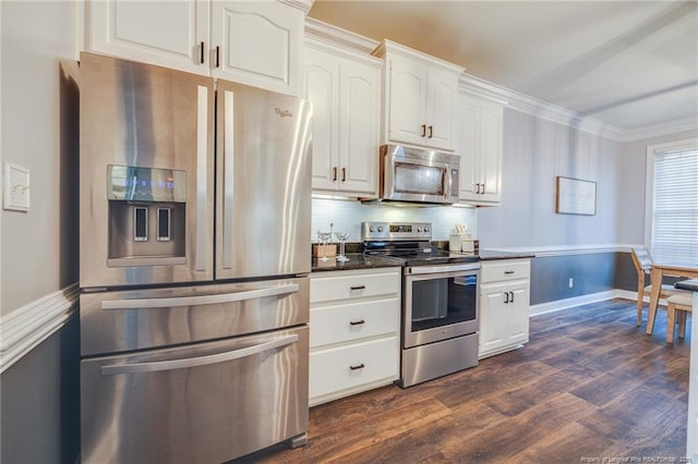 kitchen with white cabinets, backsplash, dark hardwood / wood-style floors, crown molding, and appliances with stainless steel finishes