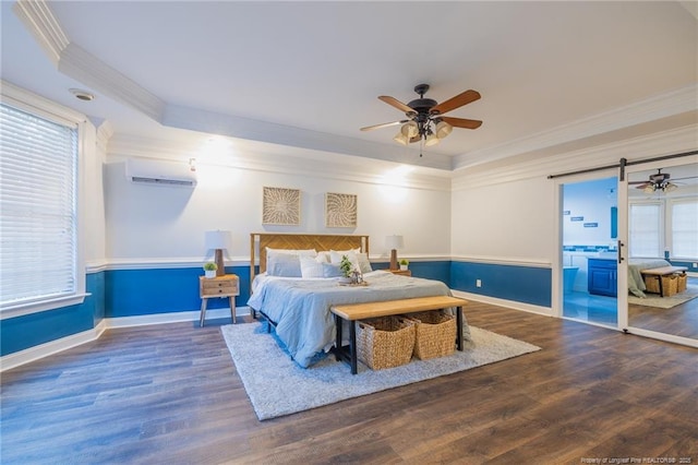 bedroom featuring connected bathroom, a raised ceiling, crown molding, ceiling fan, and dark wood-type flooring