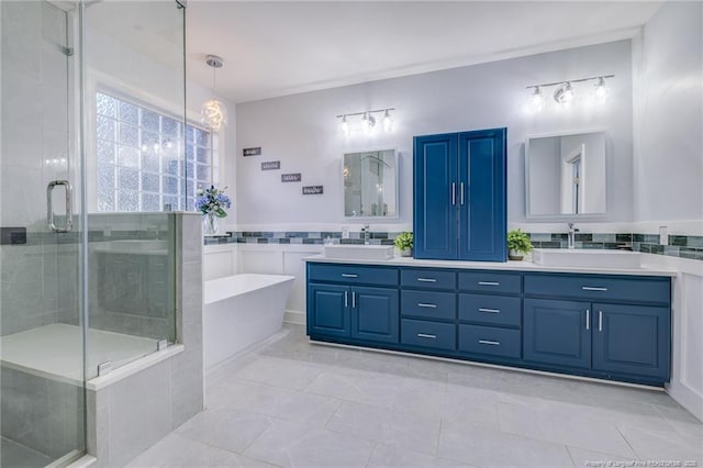 bathroom featuring tile walls, vanity, tile patterned floors, and independent shower and bath