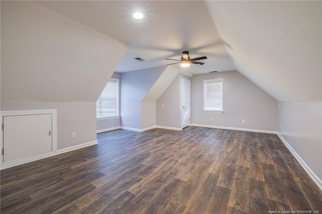 additional living space with vaulted ceiling, ceiling fan, and dark hardwood / wood-style floors