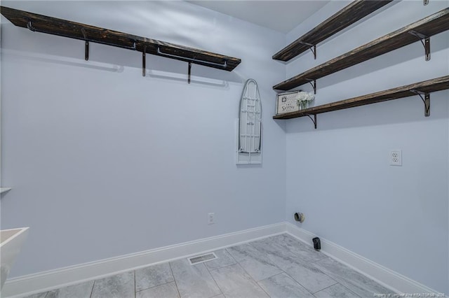 clothes washing area featuring electric dryer hookup