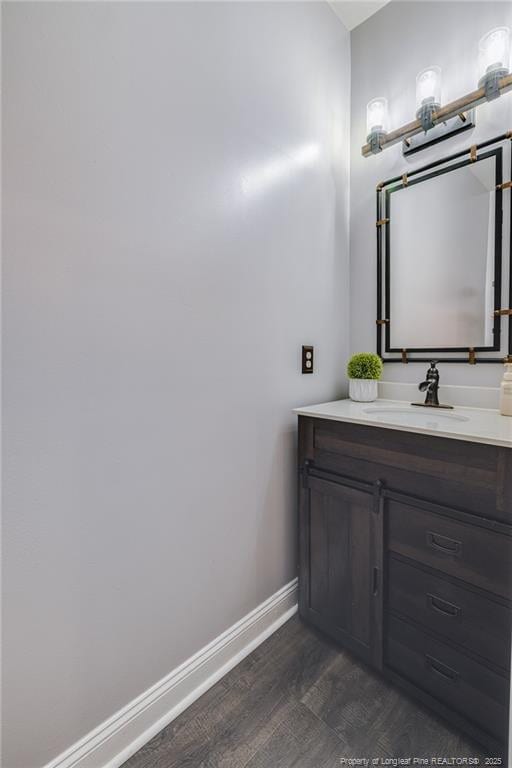 bathroom with vanity and hardwood / wood-style floors