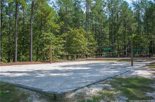 view of home's community featuring volleyball court